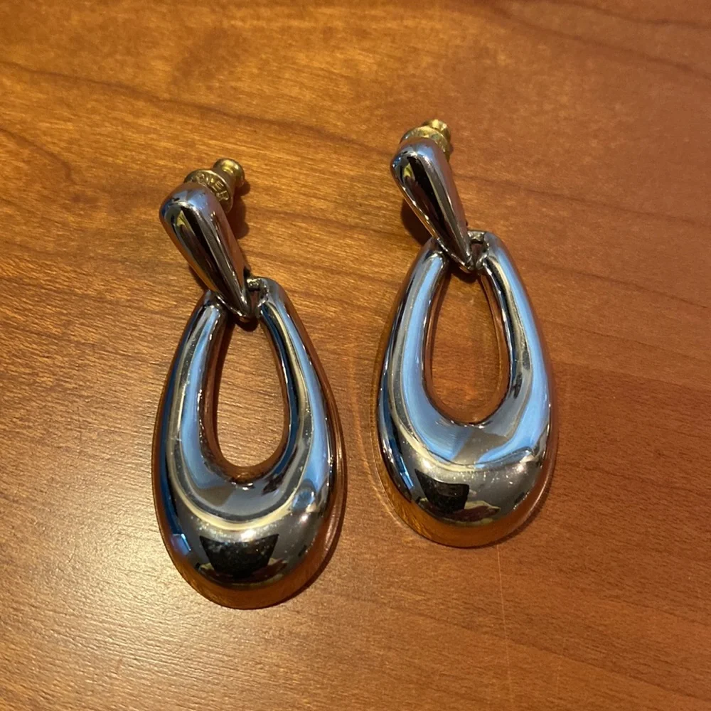 10 pairs of silver tone earrings